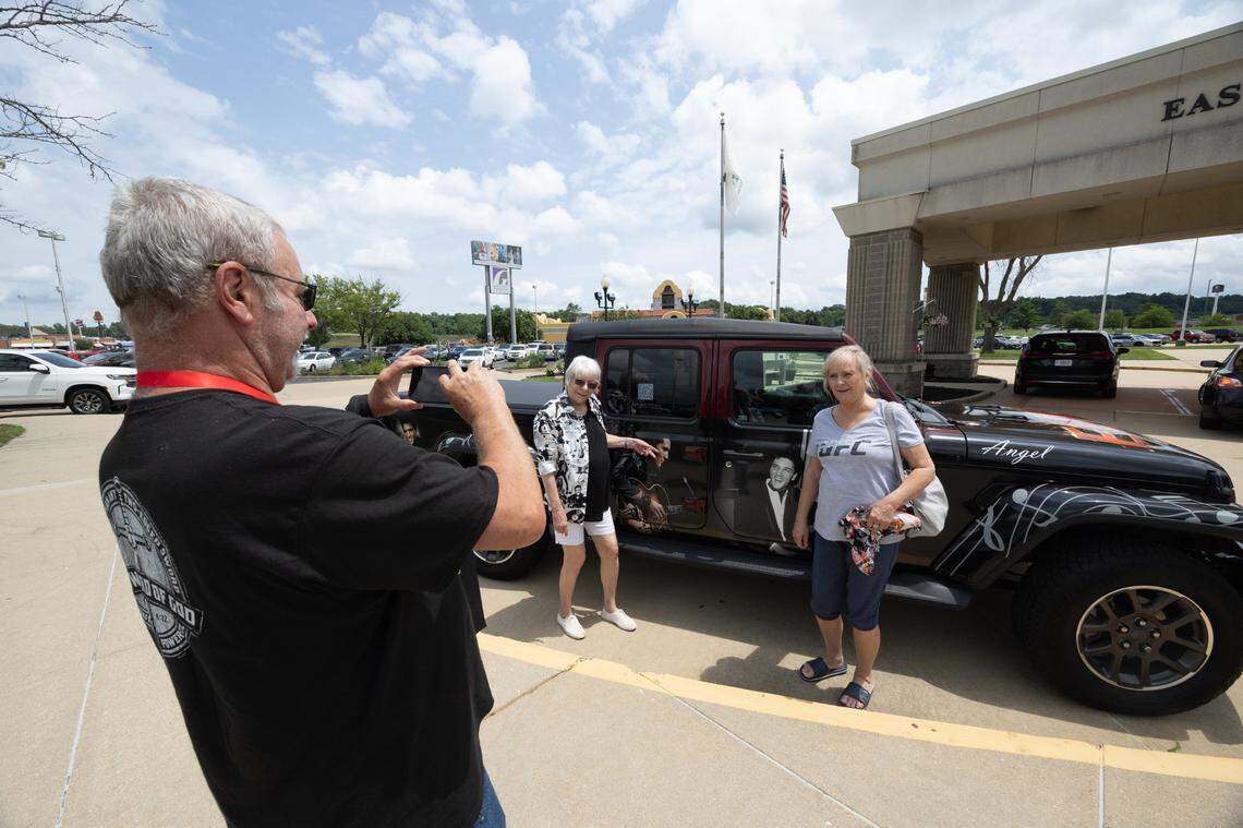 Paula Harrison and Caroline Yehlik of Wisconsin get their photo taken by Rande Clarke of Ossian, Indiana. “There’s nobody like Elvis,” Clarke said.