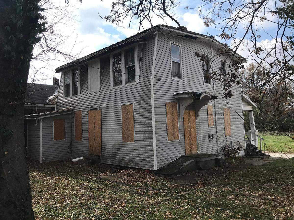 Windows are boarded up on a two-story frame home at 218 N. 11th St. in Belleville, shown here from the rear. It served as the residence of a St. Clair County sheriff during Prohibition.