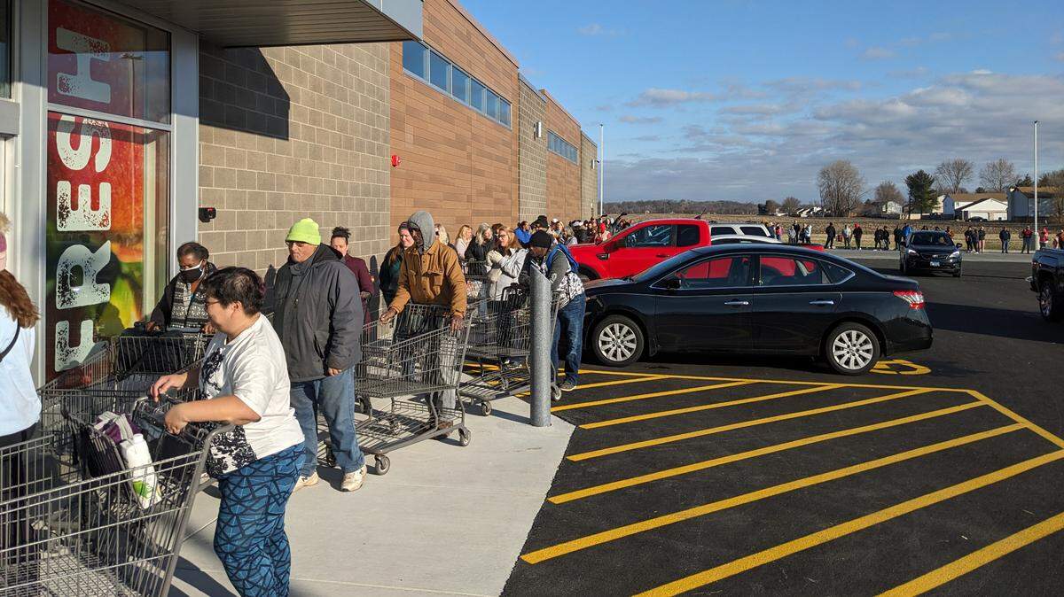 Customers wait for the doors to open at Aldi in Belleville.