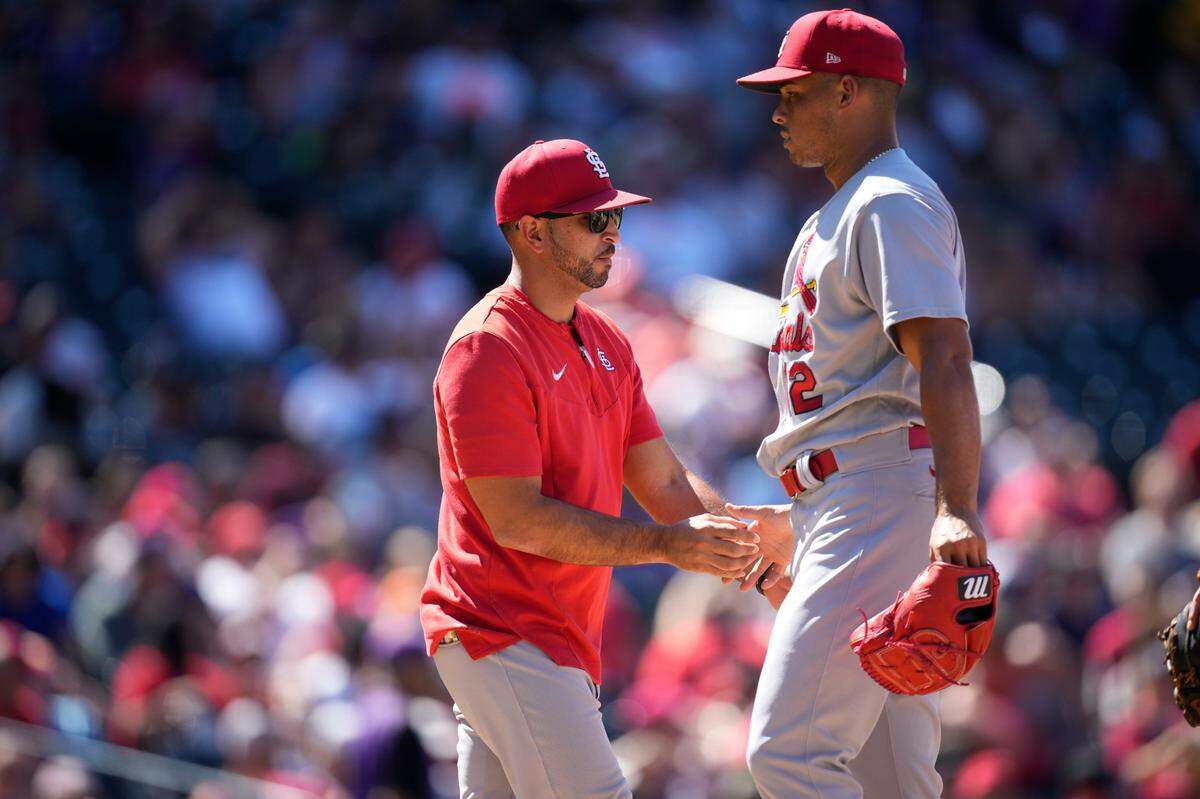 St. Louis Cardinals manager Oliver Marmol (37) takes the ball from relief pitcher Jordan Hicks as he is pulled from the mound in the seventh inning of a game last month in Colorado. Marmol will try to guide the bullpen through some choppy waters down the stretch toward the postseason.