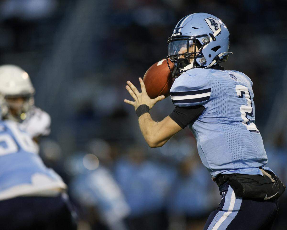 Belleville East quarterback Kayden Wood looks for an open receiver during the IHSA Class 8A second-round playoff game against Chicago Mt. Carmel.