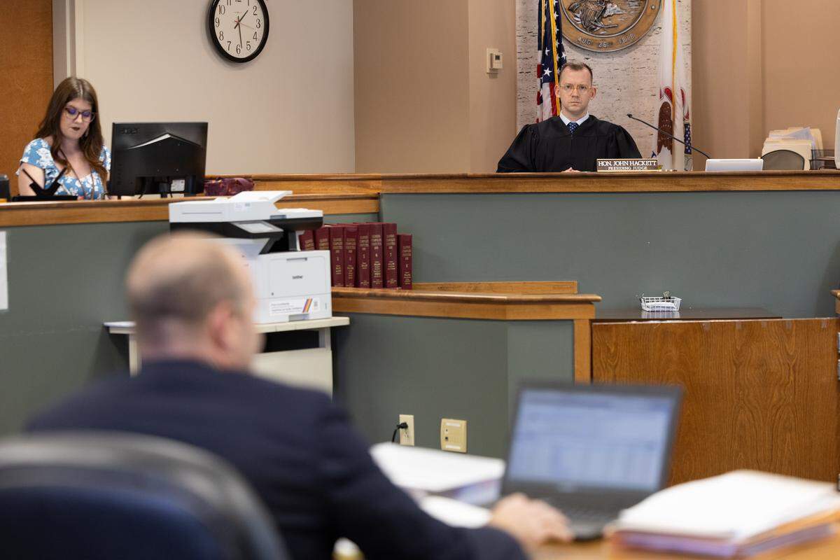 Prosecuting attorney Ryan Kemp explains to Judge John Hackett why Albert L. Zigler, who has been charged in the 1993 murder of Randy Sperino, should remain in custody until trial.