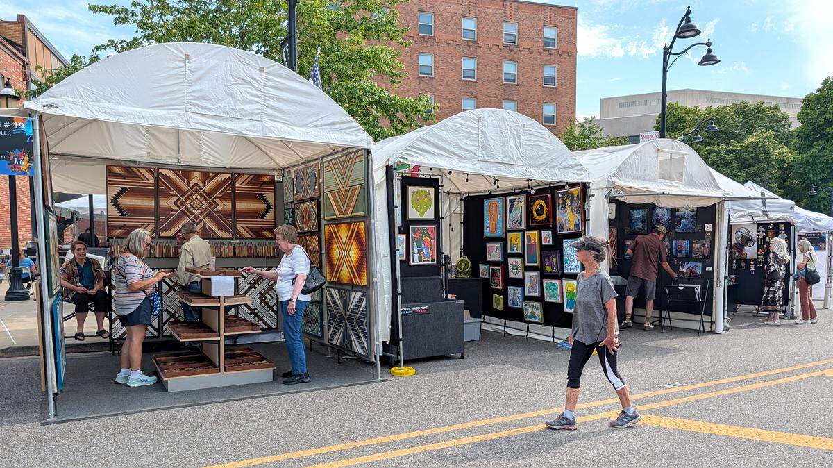 Visitors arrive early Friday afternoon to view the works at the 2026 Art on the Square in downtown Belleville.