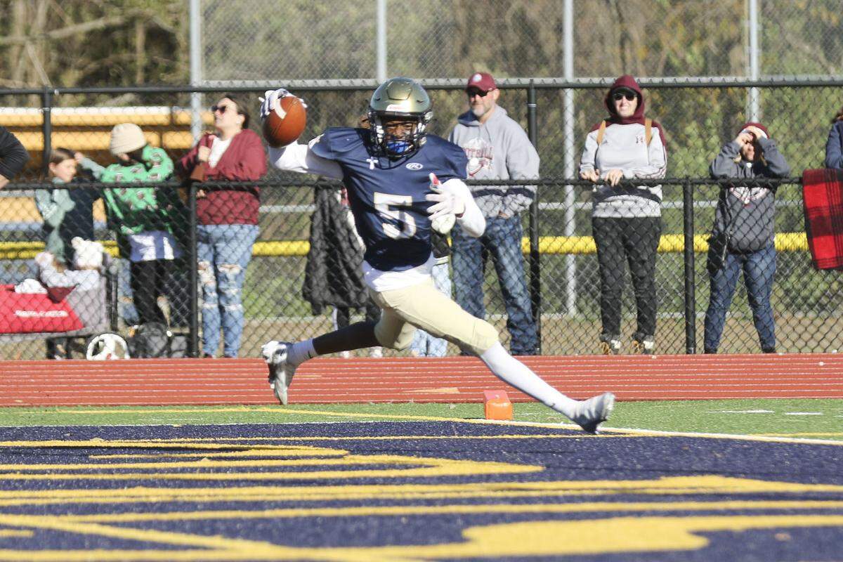 Althoff’s Jordan Lewis get the ball in the end zone after intercepting a pass during the last minute of an IHSA Class 2A second round playoff game against Red Bud. The Crusaders prevailed 26-14 and now advance to the quarterfinal round.