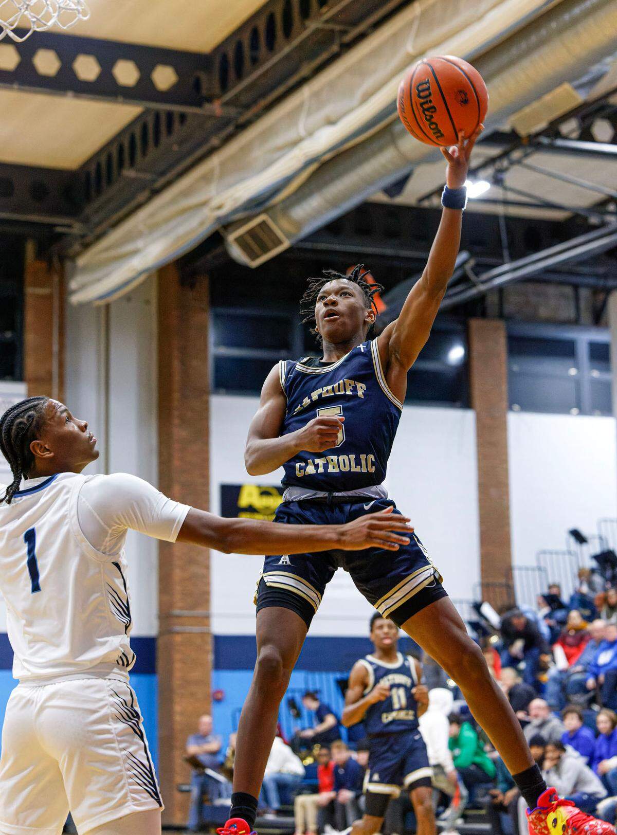 Althoff’s Jordan Lewis shoots the ball during Tuesday’s non-conference game against Belleville East. The Crusaders ultimately dropped a 78-50 outcome.