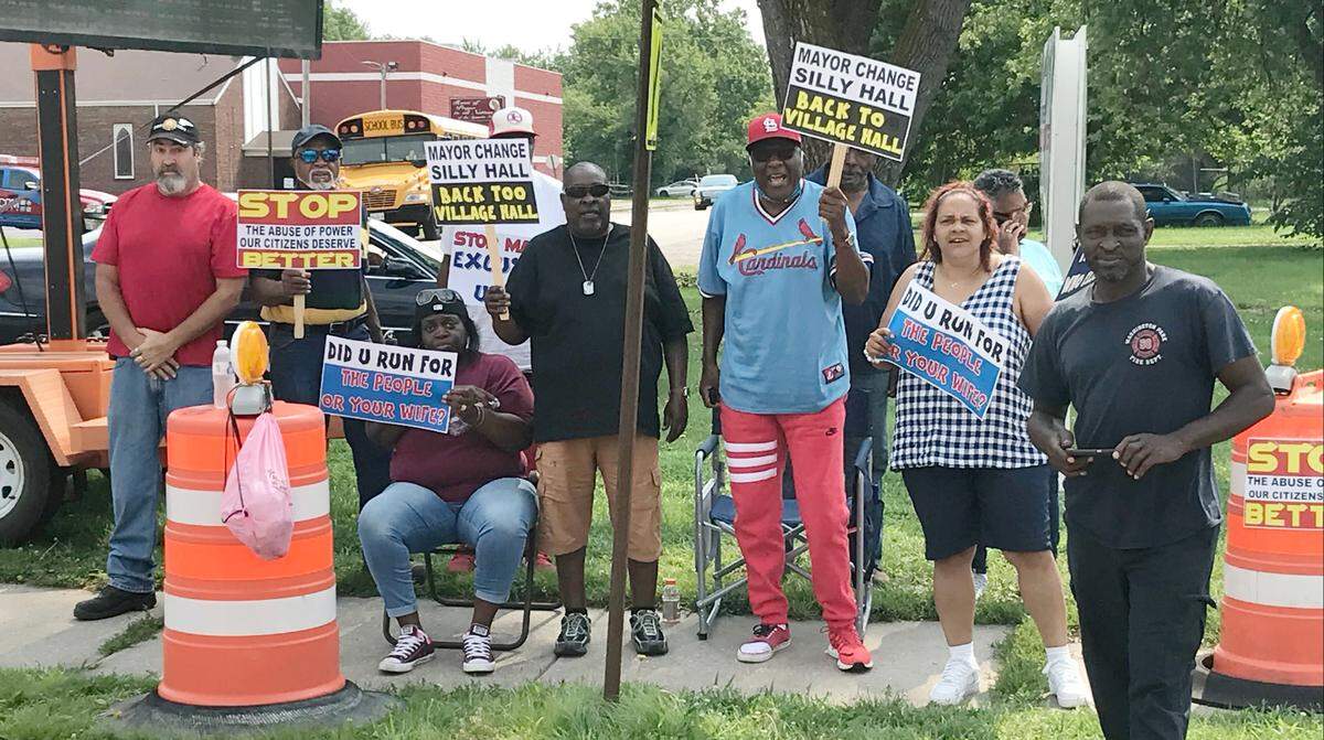 File photo from 2021, when trustees Washington Park’s Village Board protested against newly-elected Mayor Leonard Moore. The dispute ended up in court.