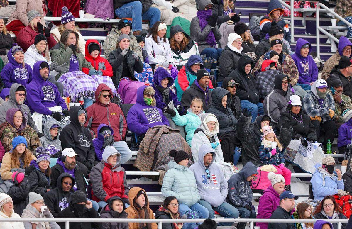 Mascoutah fans brave the cold during Saturday’s IHSA Class 5A quarterfinal game against Peoria High School. The Indians led 21-14 at halftime but ultimately fell to the Lions 36-21.