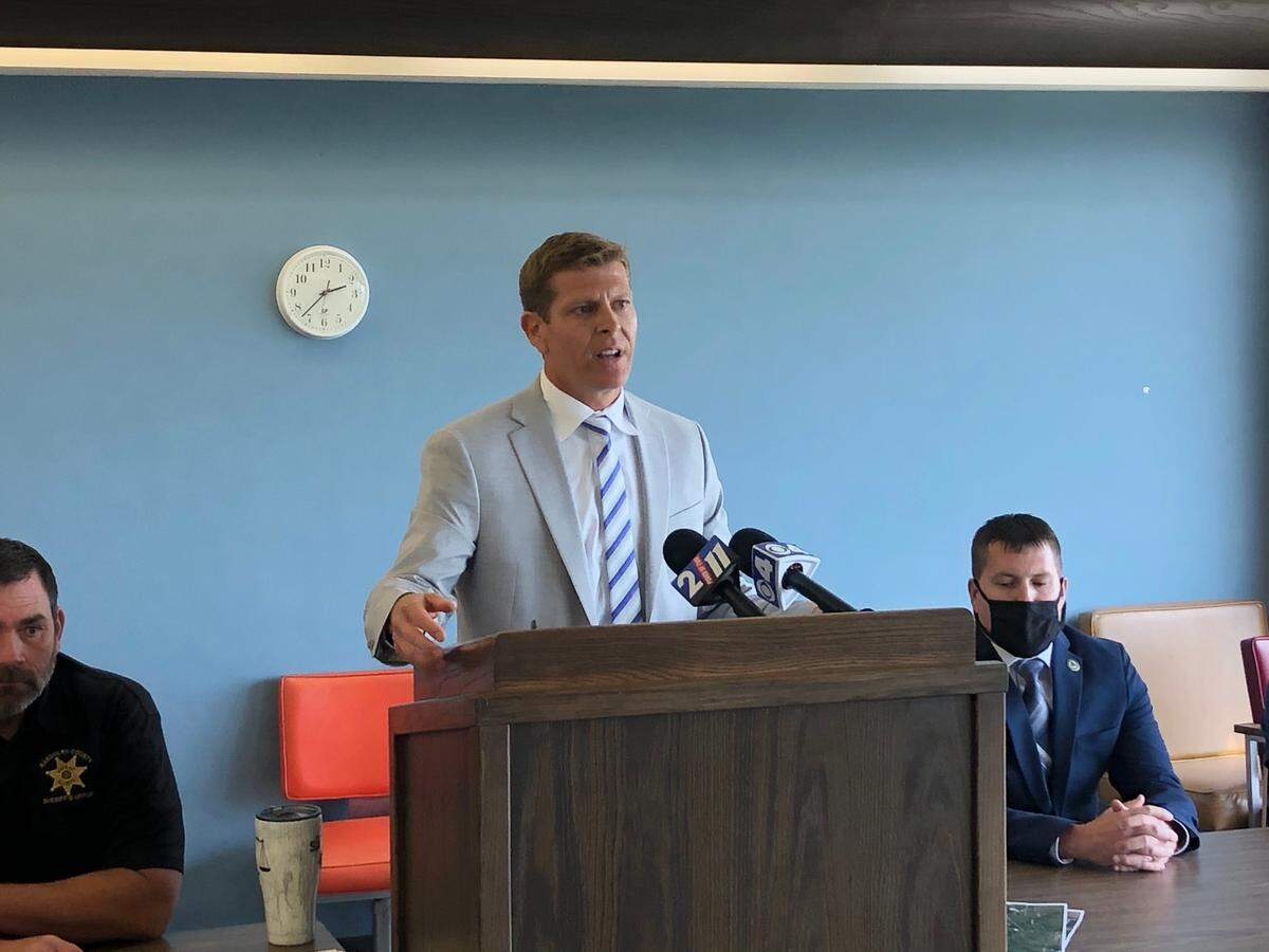 Randolph County State’s Attorney Jeremy Walker answers questions at a news conference on May 24 about a shooting involving a Red Bud police officer.