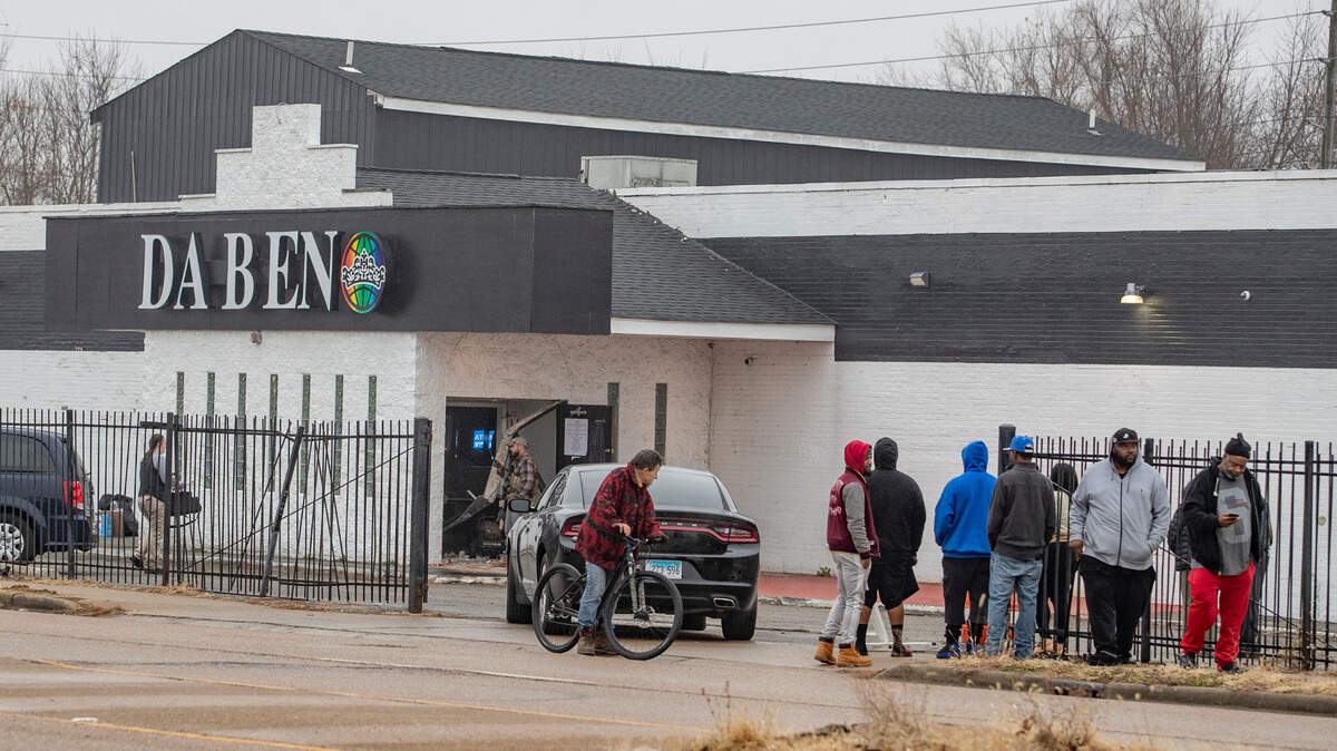 This file photo shows a small crowd gathered outside Da Beno Nite Club at 6830 State St in East St. Louis in 2022, when FBI agents were on the scene. An unrelated lawsuit involving the bar recently was dismissed in federal court. 