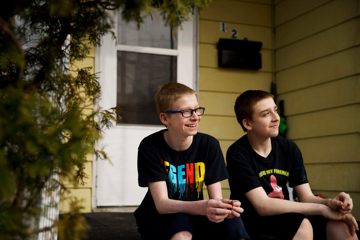 Twelve-year-old Kameron hangs out with his brother Phoenix, 14, outside their East Peoria home in March. In January, Kameron received a ticket for “assault, battery and affray” after shoving another 7th grader over a bottle of iced tea.