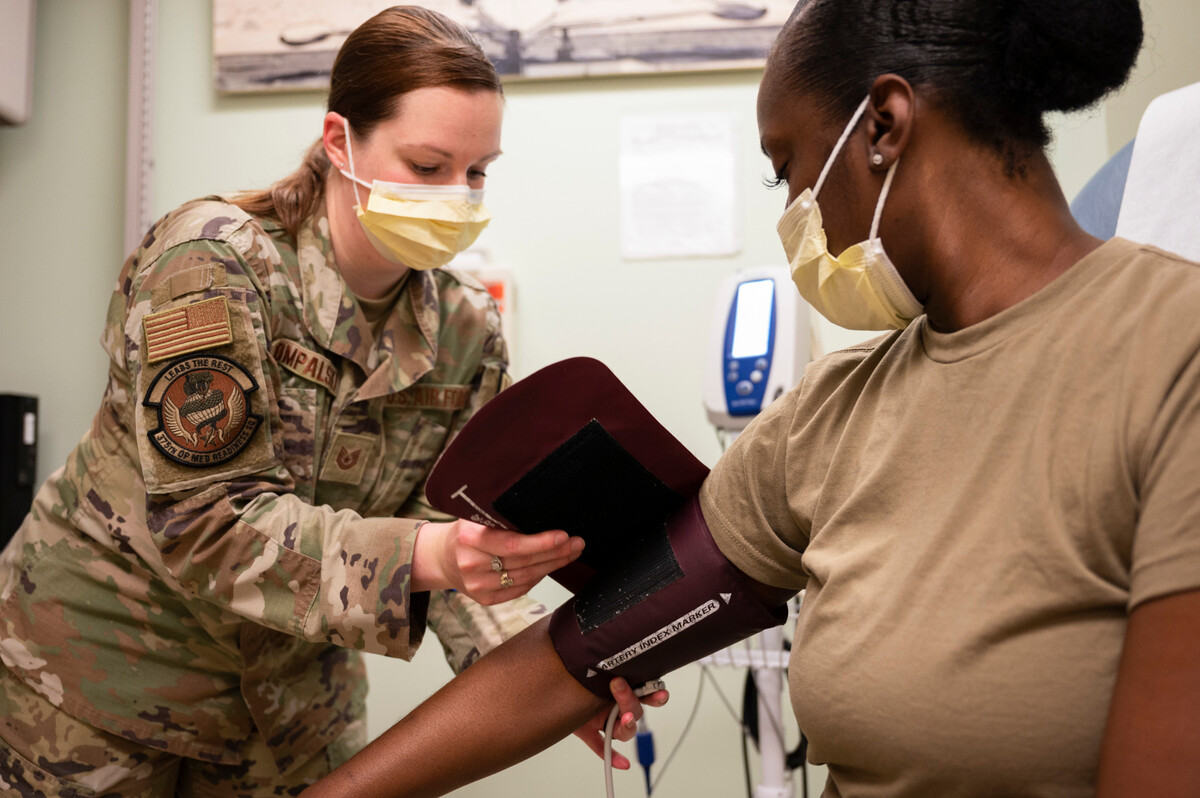 Tech. Sgt. Samantha Rompalski, 375th Operational Medical Readiness Squadron base and operational medical clinic NCO in charge, places a blood pressure cuff on a patient at the 375th Medical Group on Scott Air Force Base. The 375th OMRS supports three flying Wings and 31 tenant units including the U.S. Transportation Command and 18th Air Force in the mission of global mobility.