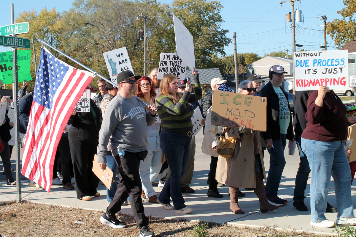 Hundreds of people marched down Main Street in Staunton on Sunday in support of local father and Caldera Bar and Grill owner Ismael Ayuzo Sandoval, who was taken into custody by U.S. Immigration and Customs Enforcement on Oct. 29.