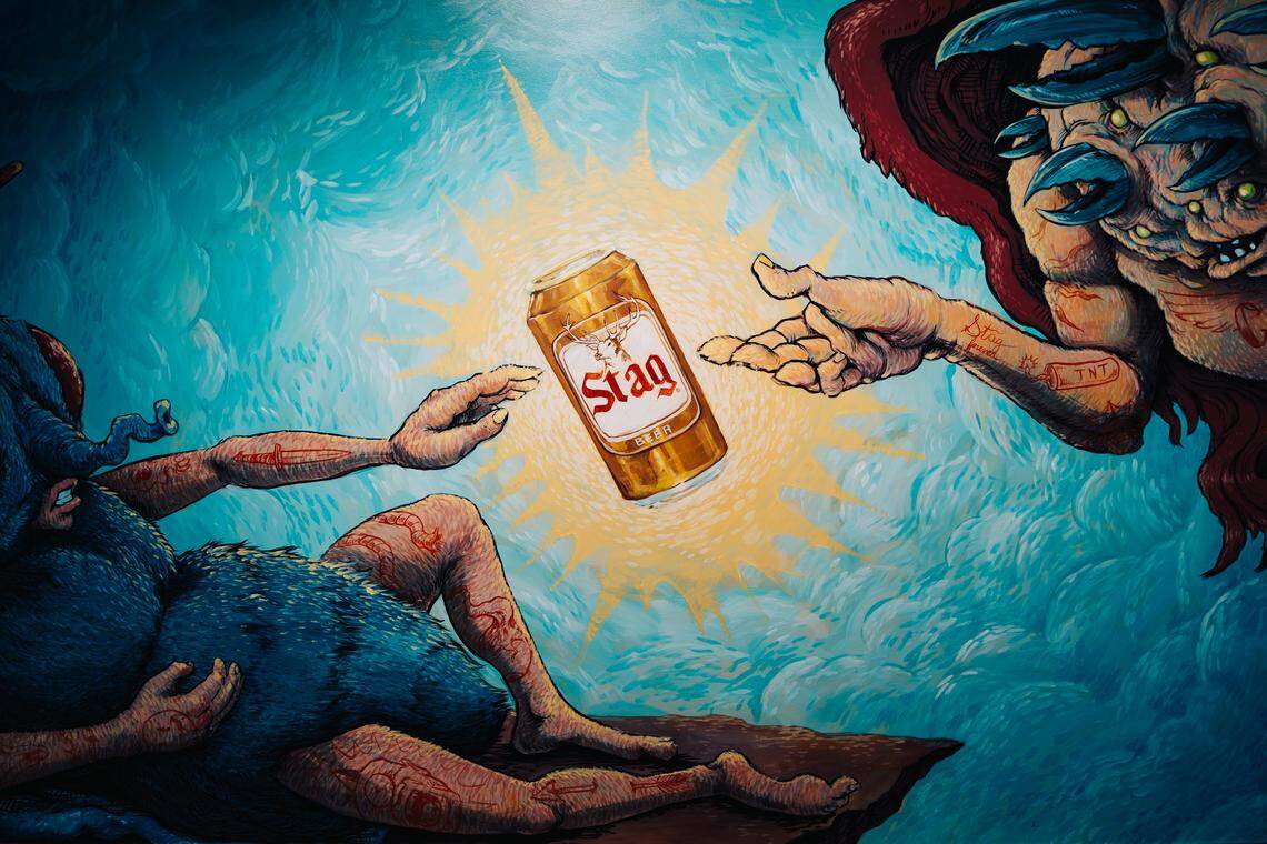 A painting depicting creatures reaching for a can of Stag Beer is painted on the ceiling of The Crow’s Nest arcade on Friday, Feb. 27, 2026, in Maplewood.