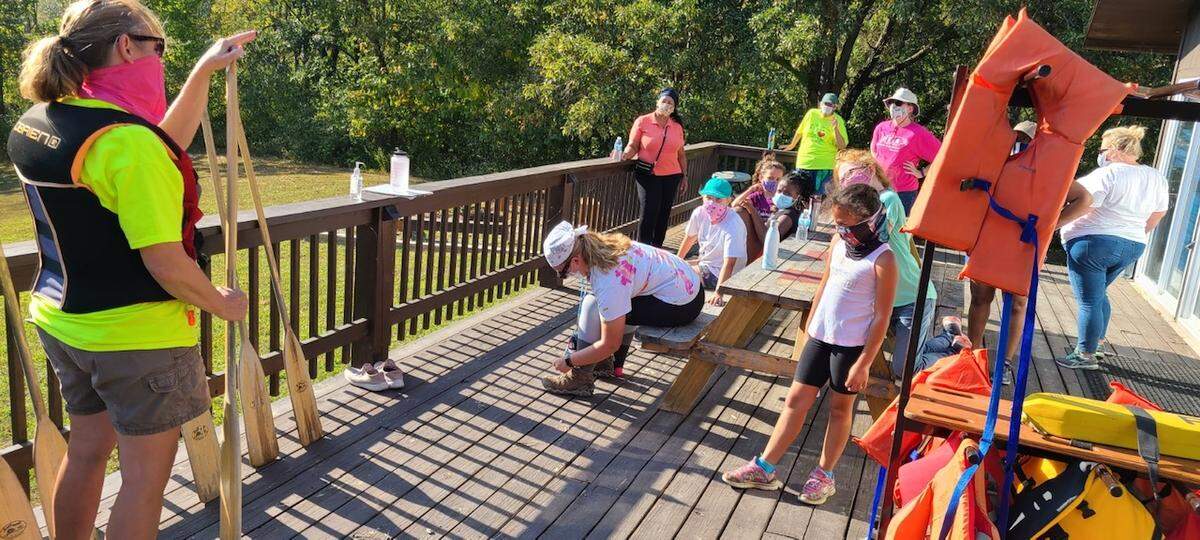 Jodie Herbstitt, leader of Belleville Troop 189, gives instructions to Girl Scouts in Service Unit 207 before canoeing at Camp Chan Ya Ta near Worden in September.