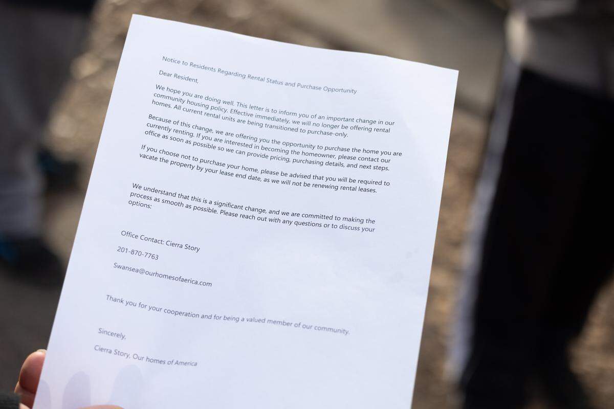 A Greenmount Station mobile home park resident holds a notice that all tenants received informing them that property owner Homes of America is ending all rental leases. Renters must either purchase their homes or move out at the end of their leases, the notice states.