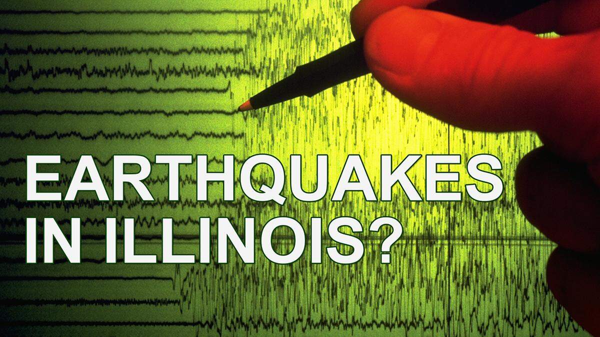 A seismographer uses a pen to point out the initial shock waves of an earthquake charted on a seismograph.