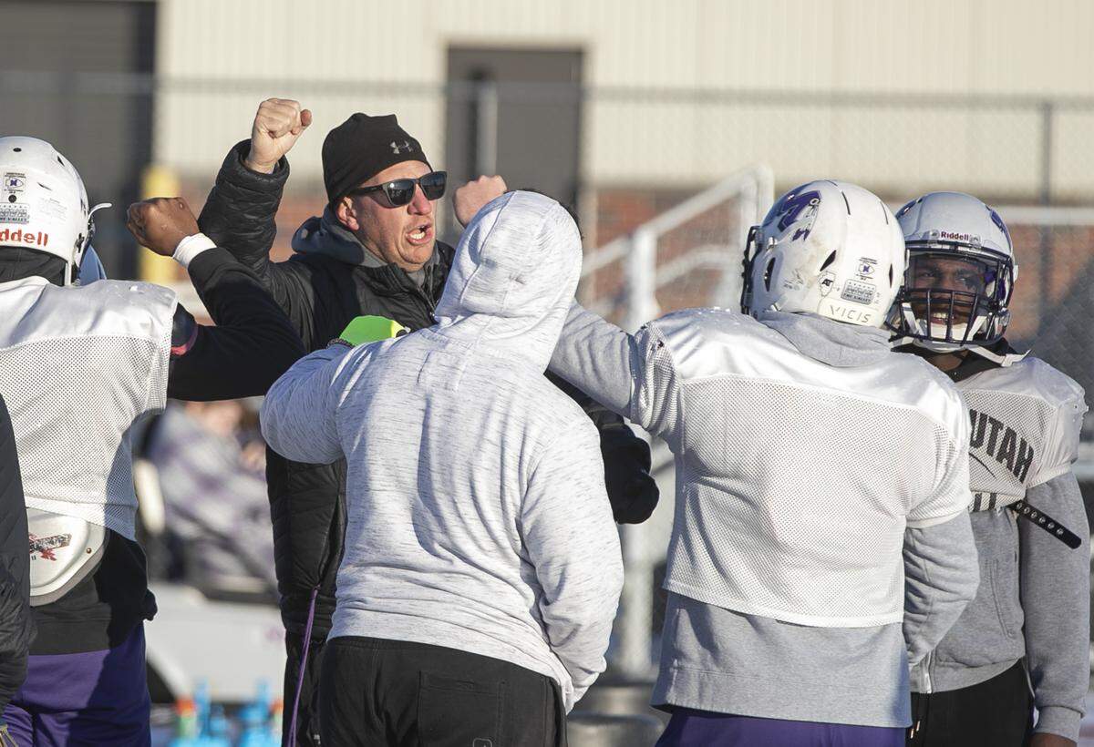 Mascoutah coach Josh Lee cheers along with his players during a recent practice.