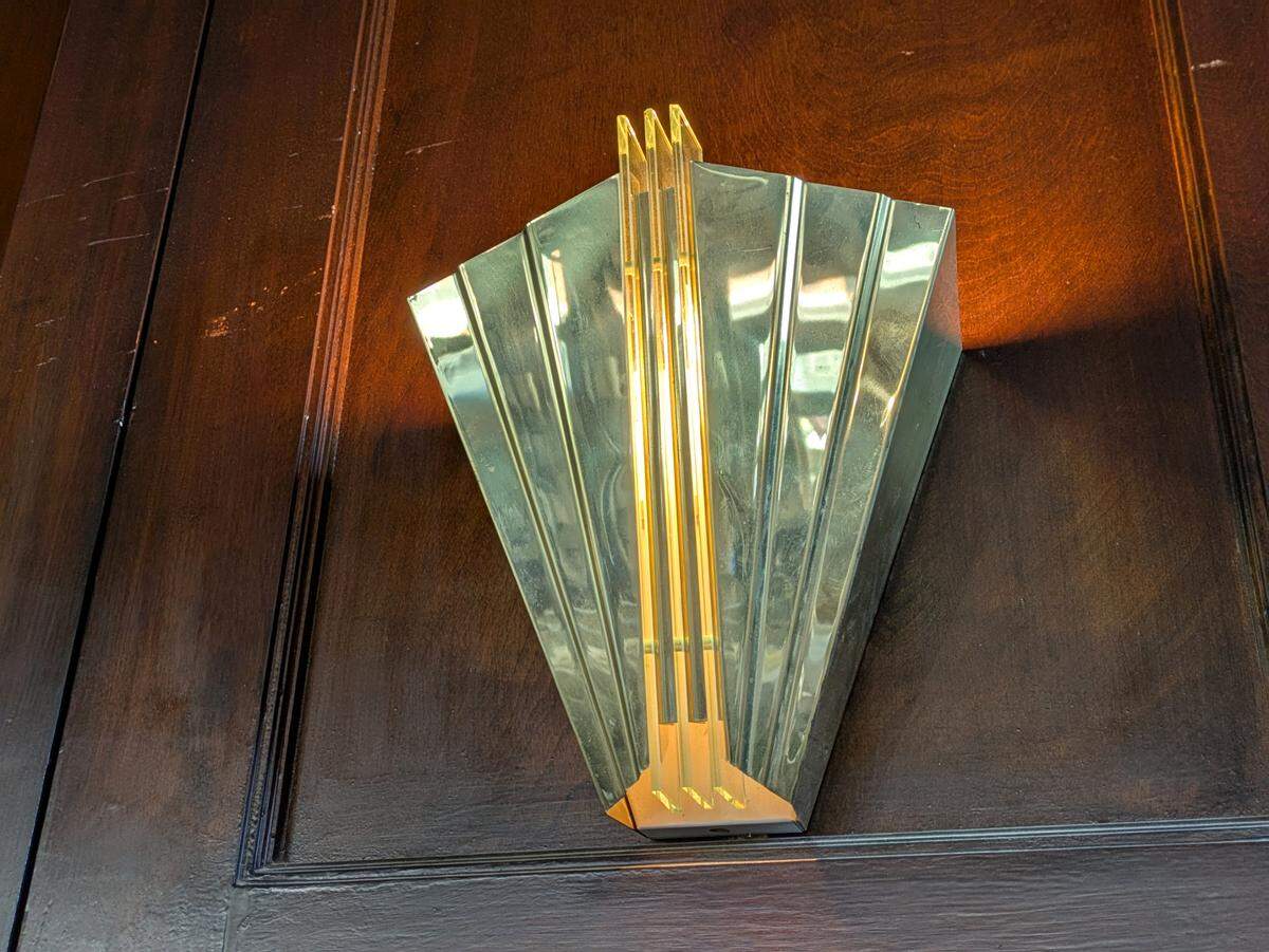 A close look at one of the new art deco wall sconces at The Harp Pub