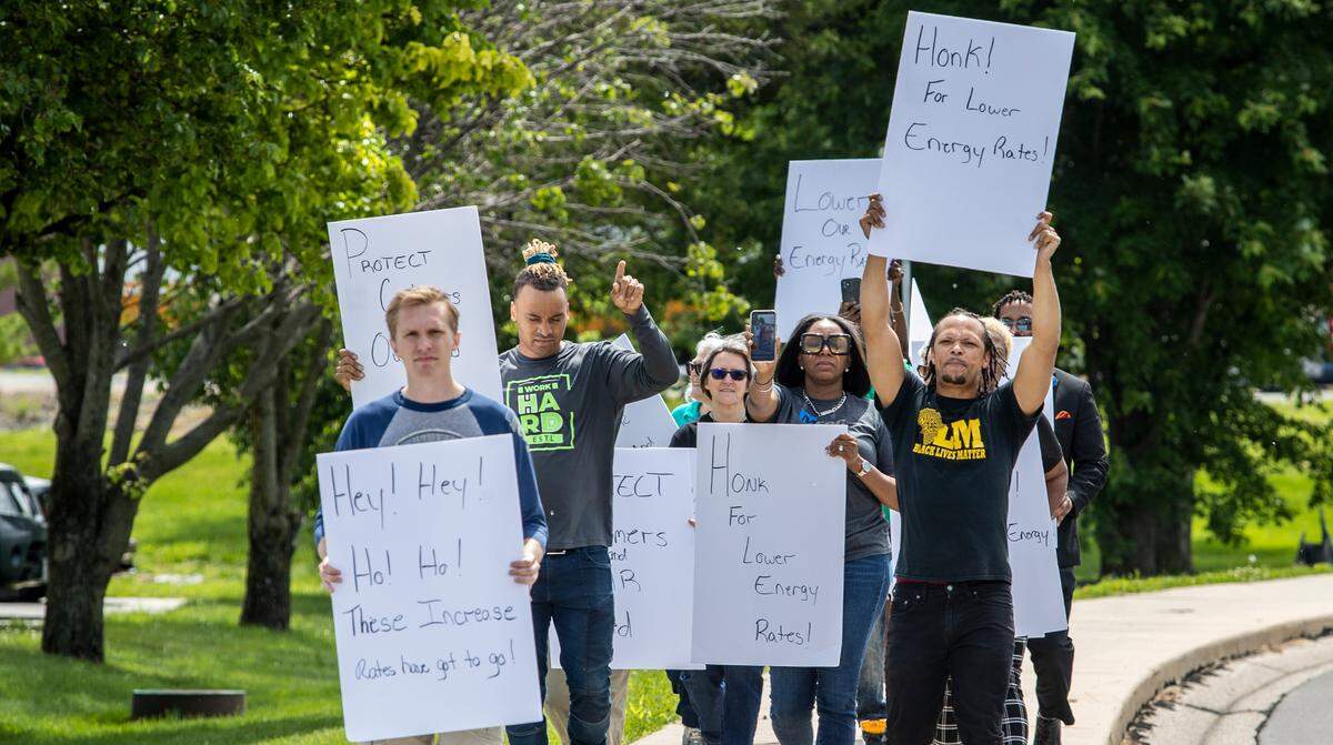 Community activists march to Ameren Illinois in Collinsville, calling on the company to help customers facing higher electric bills.