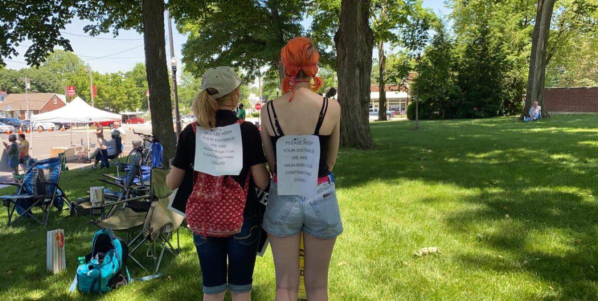 Natalia (mom) and Kat (daughter) Pruitt of Columbia attend the Waterloo protest. “It’s a balancing act between standing up for the lives of others while not compromising the lives of my family,” Kat said. She’s not at a higher risk personally, but the rest of her family is.