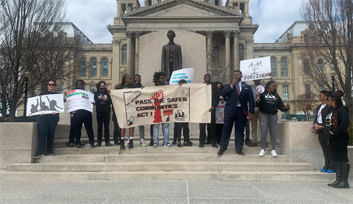 Rep. Kam Buckner, D-Chicago, joins members of the Workers Center for Racial Justice outside the Illinois State Capitol on Wednesday in support of a wage subsidy program for individuals recently released from incarceration.