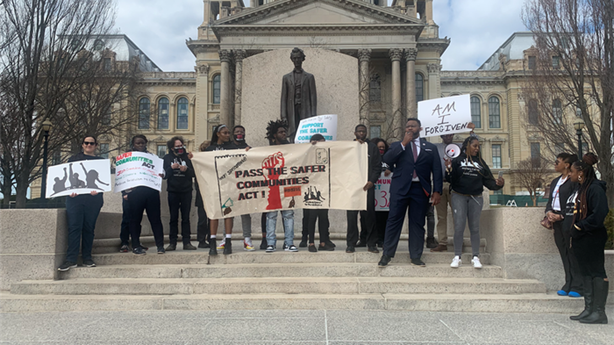 Rep. Kam Buckner, D-Chicago, joins members of the Workers Center for Racial Justice outside the Illinois State Capitol on Wednesday in support of a wage subsidy program for individuals recently released from incarceration.