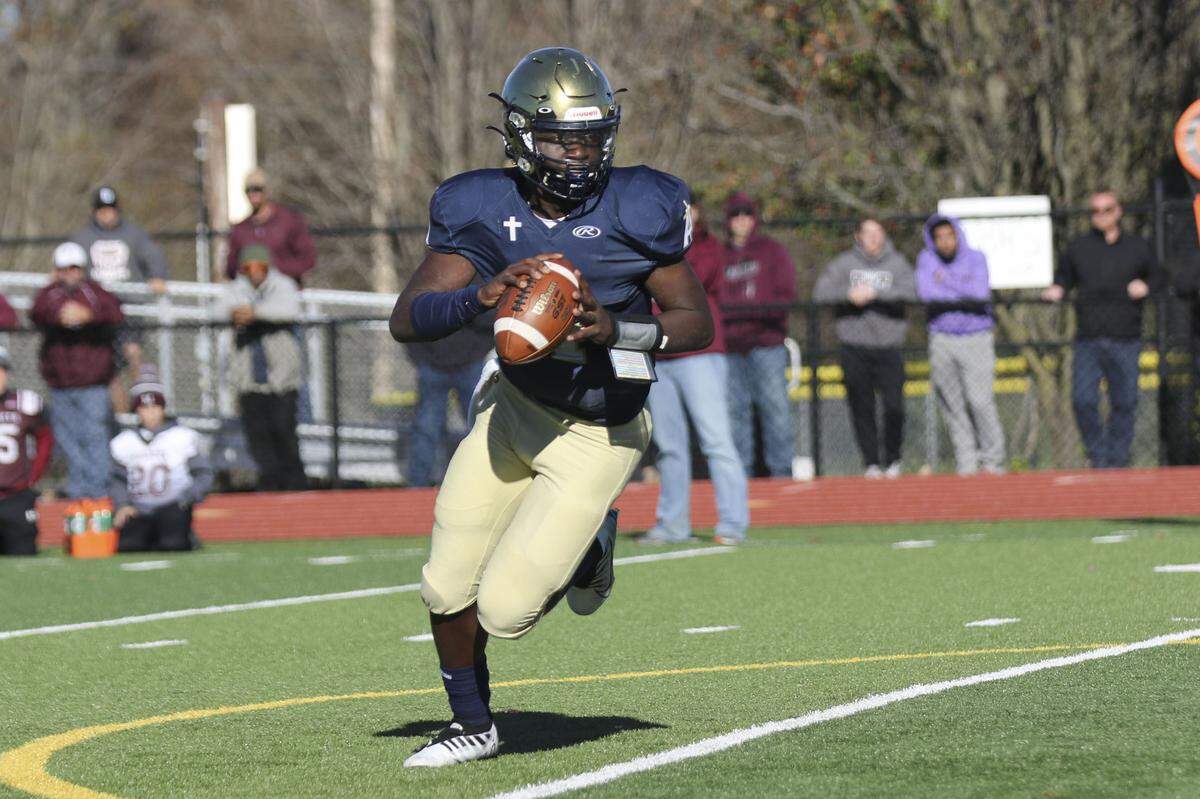 Althoff’s Braylon Grayson looks downfield for an open receiver during an IHSA Class 2A second round playoff game against Red Bud. The Crusaders prevailed 26-14 and now advance to the quarterfinal round.