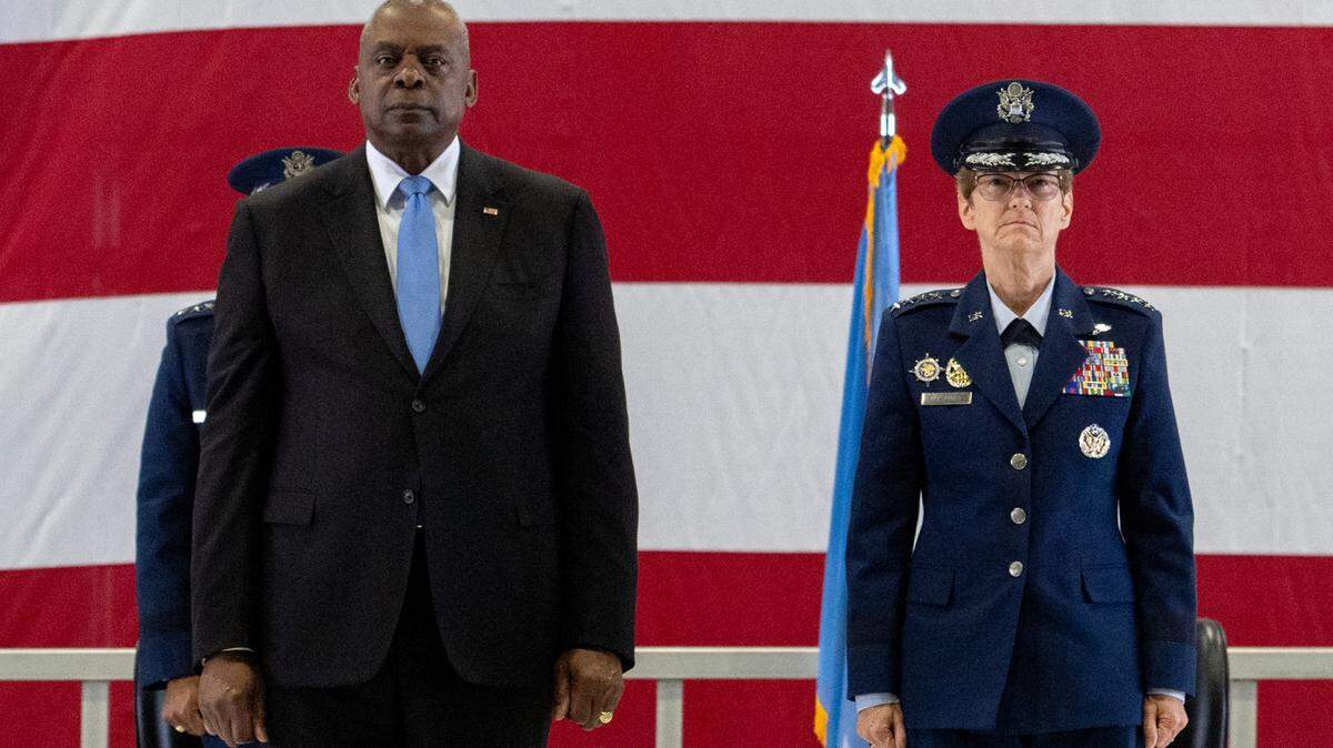 The Honorable Lloyd J. Austin III, U.S. Secretary of Defense, presents the Defense Distinguished Service Medal to Gen. Jacqueline Van Ovost, outgoing USTRANSCOM commander, during the USTRANSCOM change of command ceremony on Scott Air Force Base, Ill., Oct. 4, 2024. During the ceremony, Air Force Gen. Randall Reed assumed command from Air Force Gen. Jacqueline Van Ovost, who retired with 36 years of service in the Air Force.