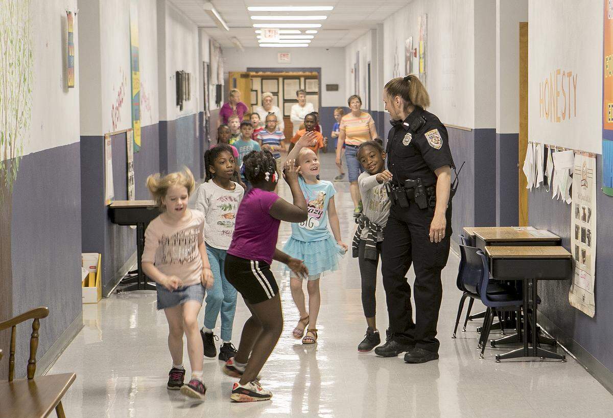 School Resource Officer Cheryl Venorsky interacts with High Mount School students as she makes her rounds at the school.  