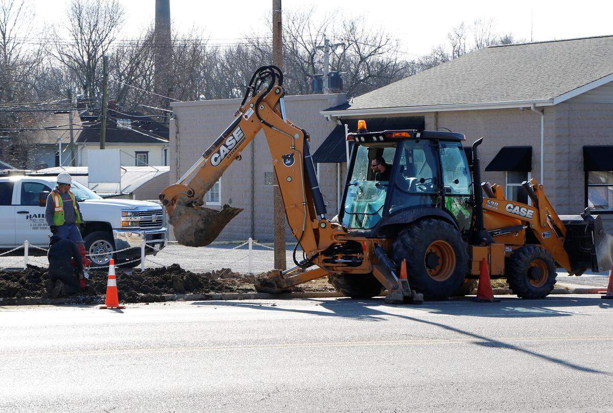 A Haier Heating and Plumbing crew works on a city infrastructure project on Broadway in Highland. The city hopes that the replacement of several aging water mains in the area will cut down on the number of main breaks and boil orders in the coming years.