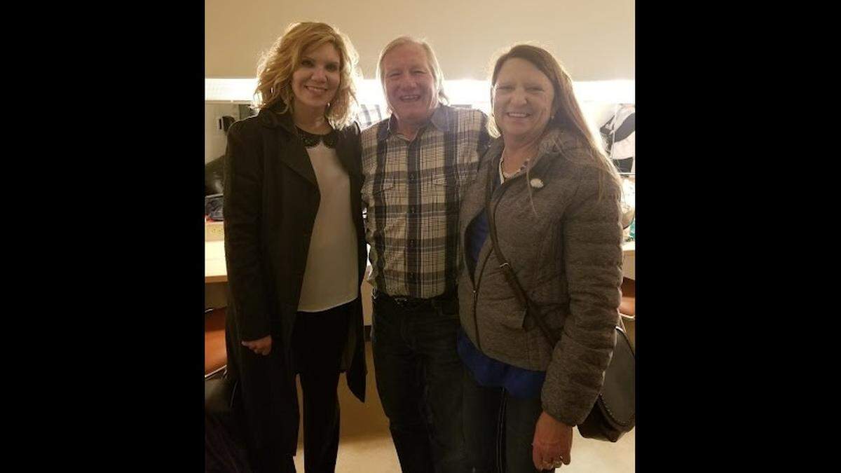 George Portz, center, and his significant other, Deanna “Dee” Hardgrave, right, pose backstage at The Sheldon concert hall in St. Louis with bluegrass and country singer and musician Alison Krauss, who won one of his fiddle contests as a girl.