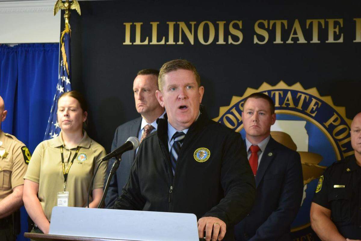 Illinois State Police Director Brendan Kelly, center, released toxicology results of the driver involved in a crash that killed four children at a central Illinois after-school program during a news conference Thursday in Springfield.