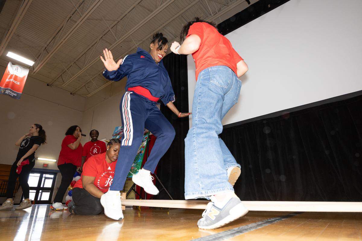 Jackie Joyner-Kersee practices an old agility training exercise with students during an event for Women and Girls in Sports Day at the Jackie Joyner-Keree Center in East St. Louis on Feb. 25.