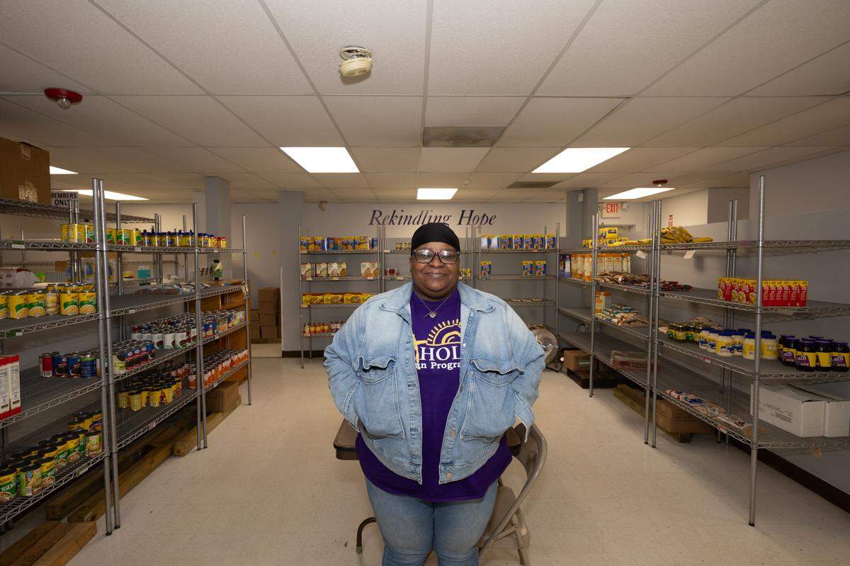 DeKale Jackson, pantry coordinator for Catholic Urban Program’s food pantry, stands in the middle of its sparse shelves. Jackson said demand has slowly risen, and she worries about the coming weeks. “I don’t even want to think about what it’s going to be like in a few week once SNAP runs out,” Jackson said, referring to the Supplemental Nutrition Assistance Program, also known as food stamps.
