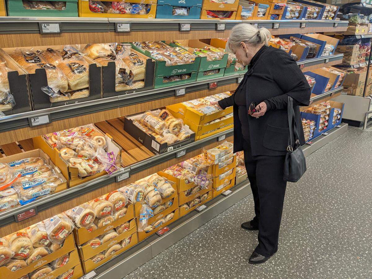 Belleville Mayor Patty Gregory browses in the bread section at the new Aldi store in Belleville.