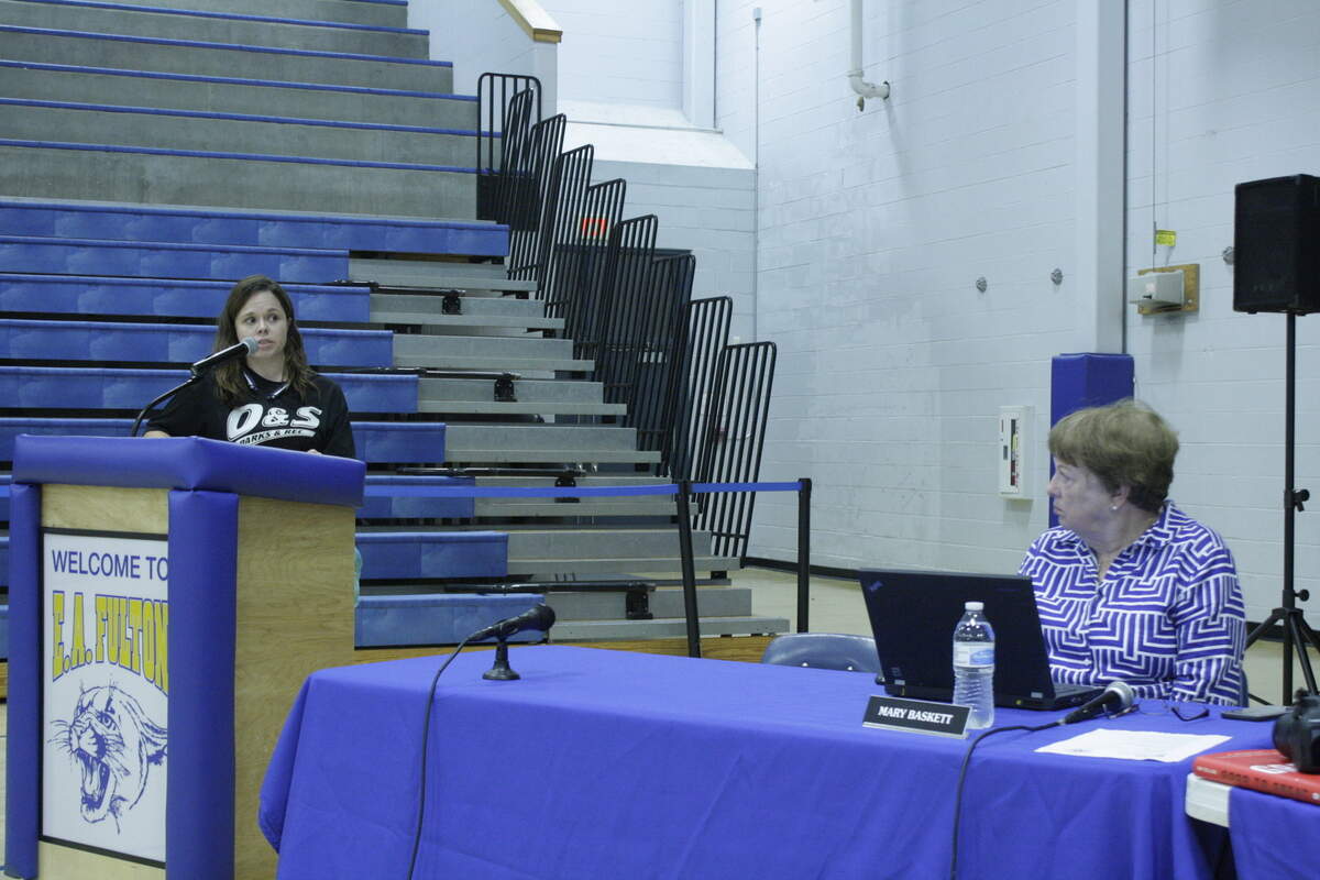 Christie Livingston speaks during the June 19 O'Fallon School District 90 board meeting at Fulton Jr. High.