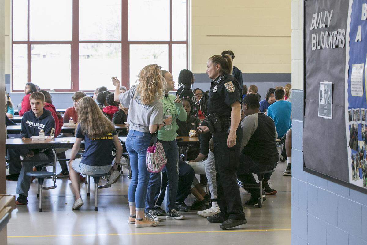 School resource officer Cheryl Venorsky interacts with High Mount School students during lunch.