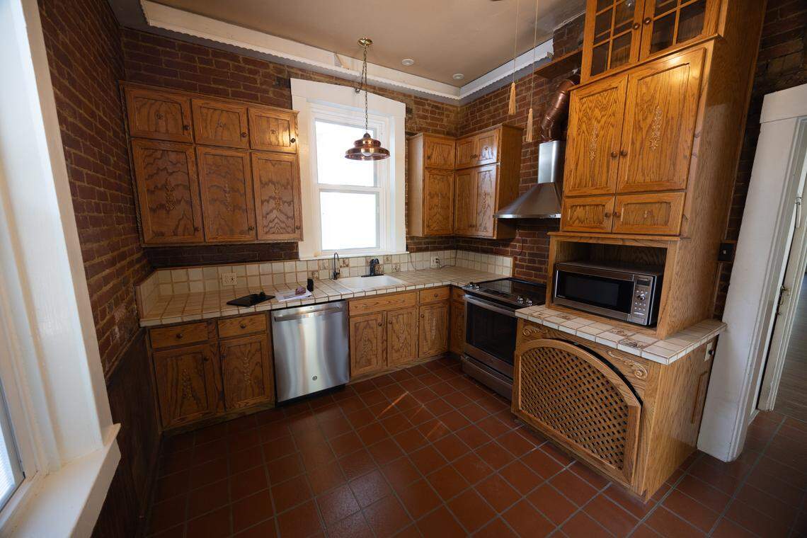 The historic charm is still present in a modernized kitchen with custom cabinets.