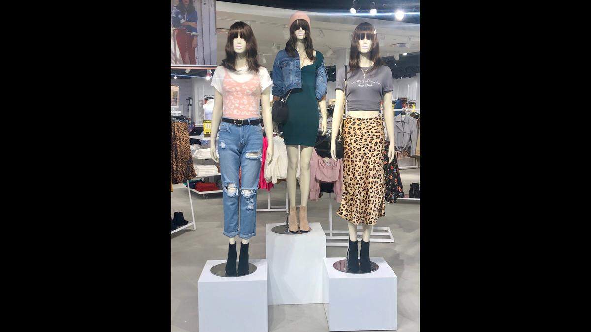 Forever 21 fashions are displayed on three mannequins in the window at its new, larger store at St. Clair Square shopping mall in Fairview Heights. It opened Friday.