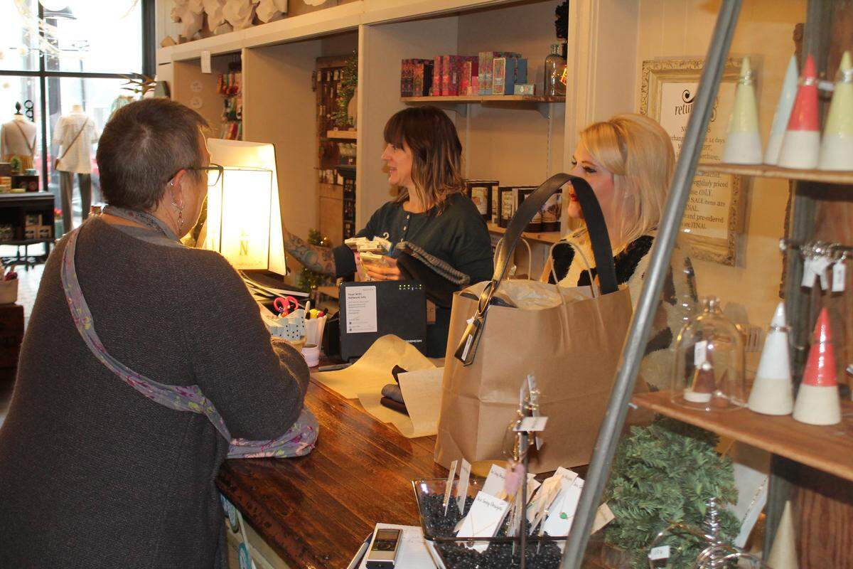 Andria Powell, center, said customers who support a shop such as hers, Circa Boutique + Gifts in downtown Belleville, help promote the local economy.
