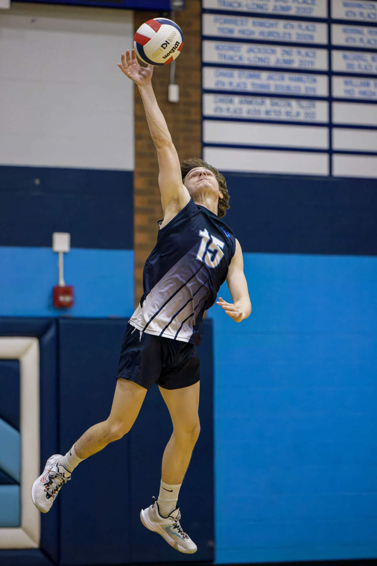 Belleville East’s Tanner Stinnett serves the ball against O’Fallon during a match Thursday, May 11. The visiting Panthers ultimately prevailed 25-21, 25-19 in a showdown between two of the metro-east’s top boys volleyball teams. The Lancers later lost to the Panthers in the IHSA postseason to finish their outstanding season at 31-4-2. “The biggest thing is we have to get more high schools in our area to take a chance and add the sport. It gives opportunities to more kids,” said longtime Belleville East coach Joe Nesbit.