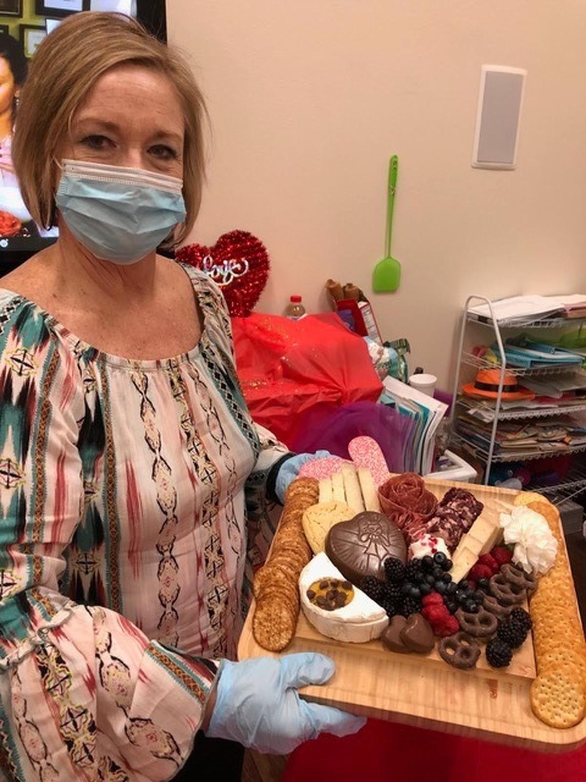 Cedarhurst of Highland residents participated in a virtual charcuterie event hosted by Candi Graves of Grazeful Gatherings in Columbia. Pictured is Cedarhurst of Highland Director of Sales Mae McNamee with a finish board..