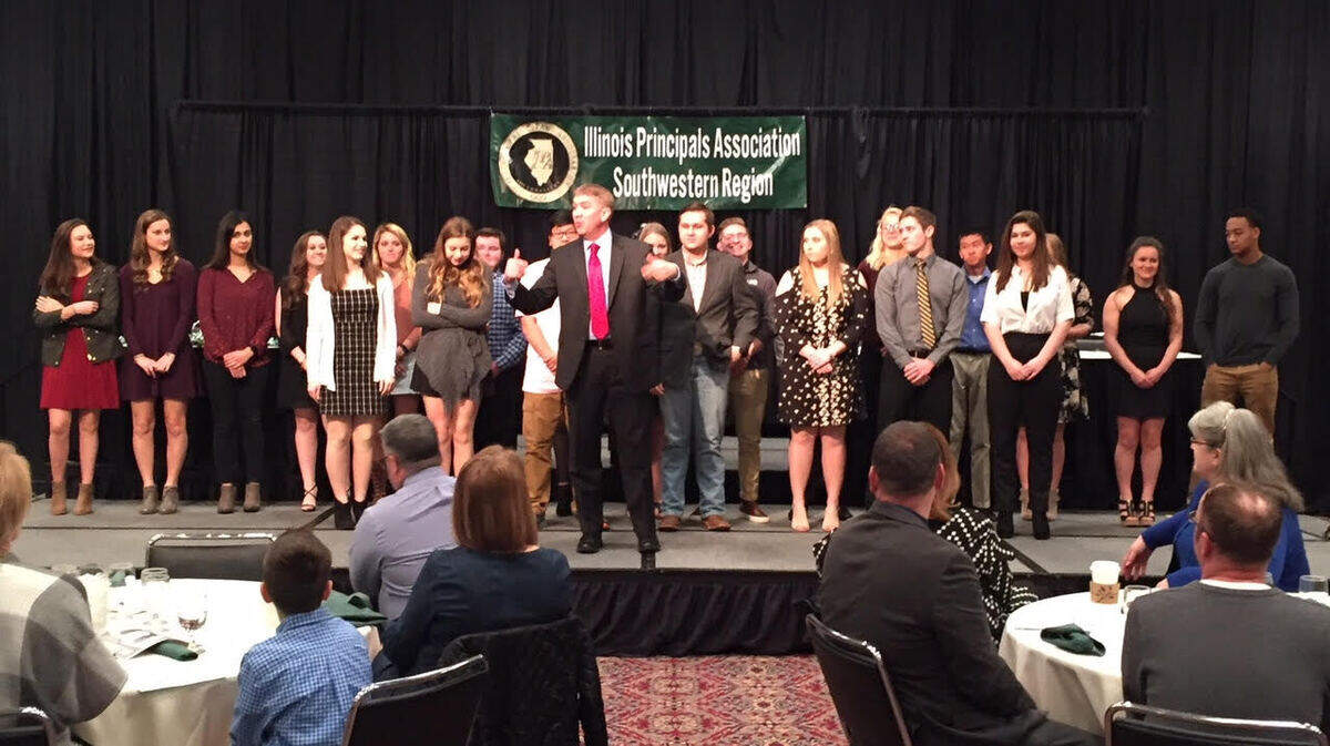 Keynote speaker Jason Leahy and the high school senior award winners at the Illinois Principals Association award breakfast on April 18, 2018, at the Collinsville Gateway Center.