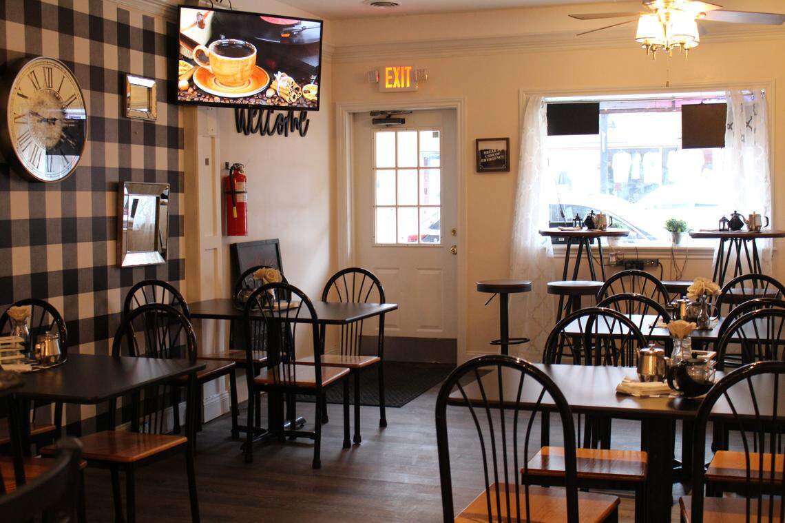 Sip & Chew Express restaurant and coffee shop in downtown Belleville has high-top and regular tables decorated with vases of burlap roses and miniature teapots.