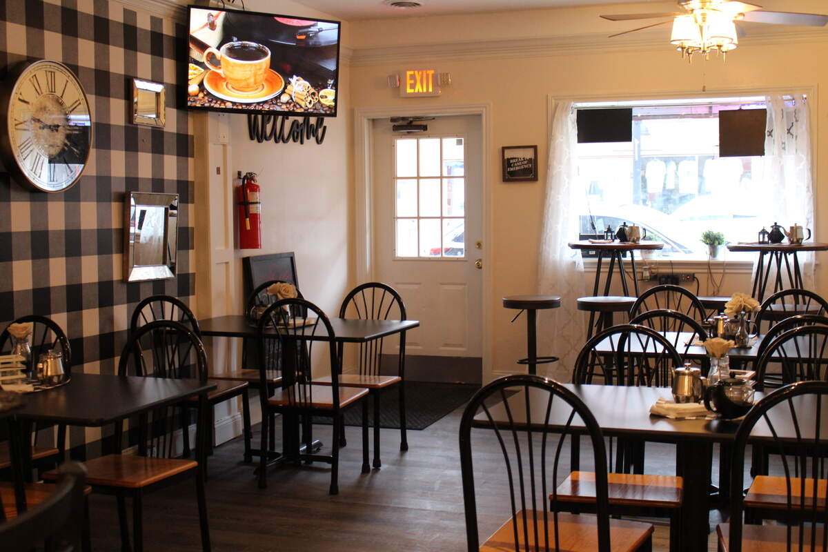 Sip & Chew Express restaurant and coffee shop in downtown Belleville has high-top and regular tables decorated with vases of burlap roses and miniature teapots.