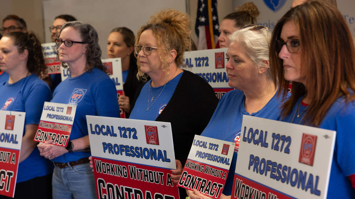 Teachers with Cahokia Federation of Teachers Local 1272 hold signs during a March 18 news conference in Fairview Heights regarding the union and their complaints with district leadership, in particular superintendent Curtis McCall Jr.