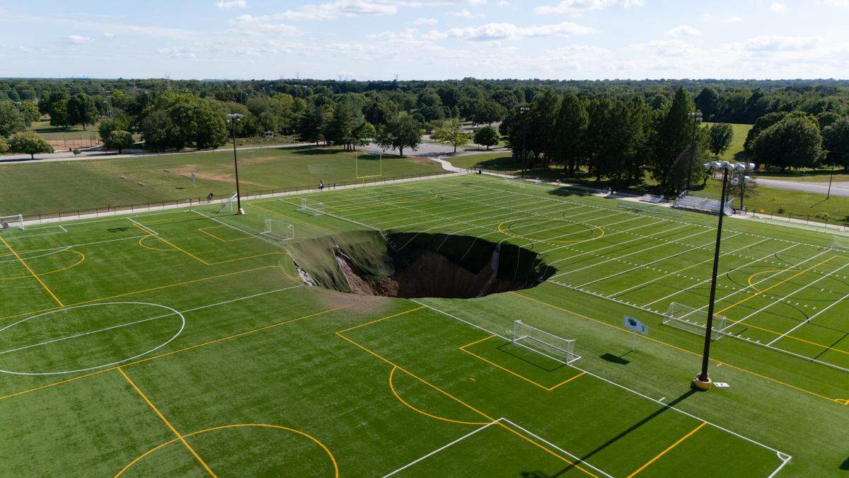 A sinkhole in Gordon F. Moore Park in Alton, Ill. on June 26, 2024 after an old mine collapsed and brought down a field light.