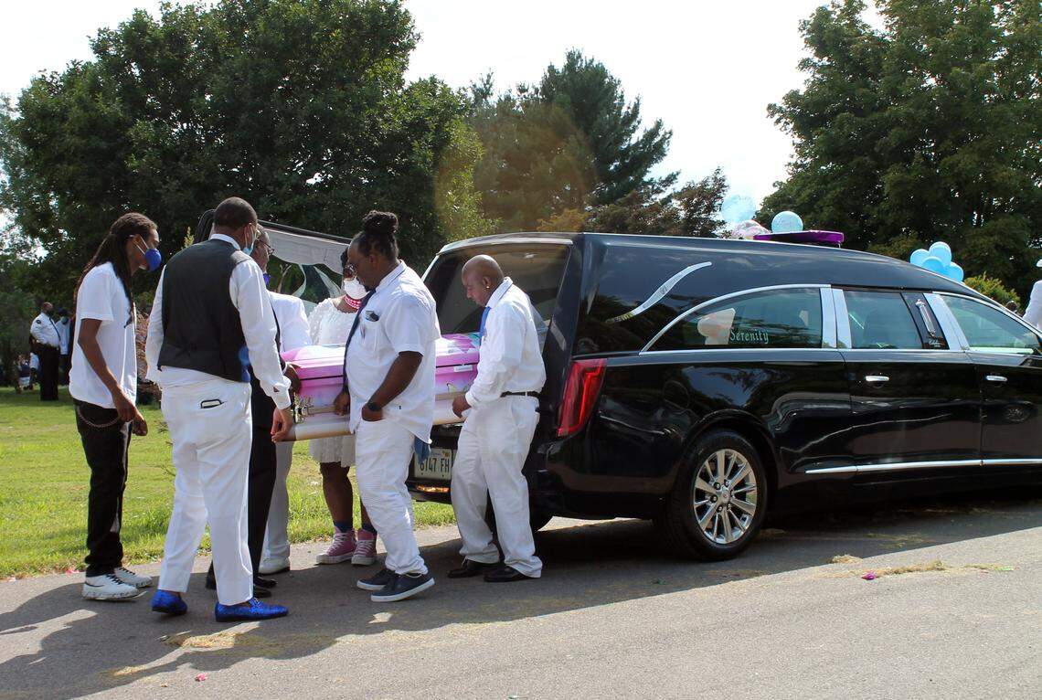 Pallbearers remove 2-year-old Loy’el Dunigan’s coffin from a hearse for graveside services that took place Aug. 21, 2021 at Sunset Gardens of Memory Cemetery Millstadt. Loy’el was one of five children, all siblings, who died in an Aug. 6, 2021, fire at their East St. Louis home. She was the youngest.
