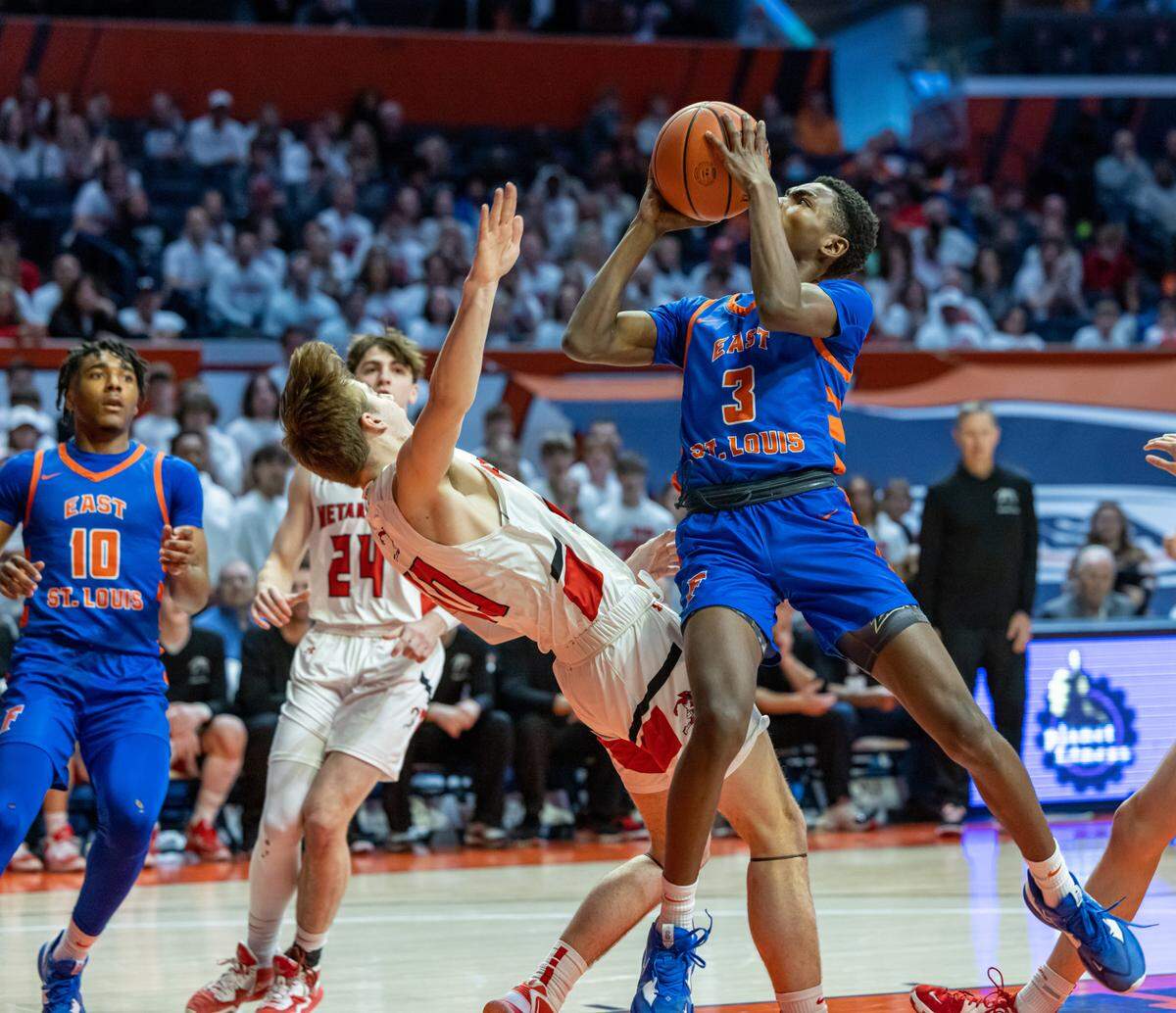 East St. Louis’ Dainen Rucker shoots the ball during Friday’s IHSA Class 3A state semifinal game against Metamora at State Farm Center in Champaign on the campus of the University of Illinois. The Flyers ultimately fell to the Redbirds 50-43.