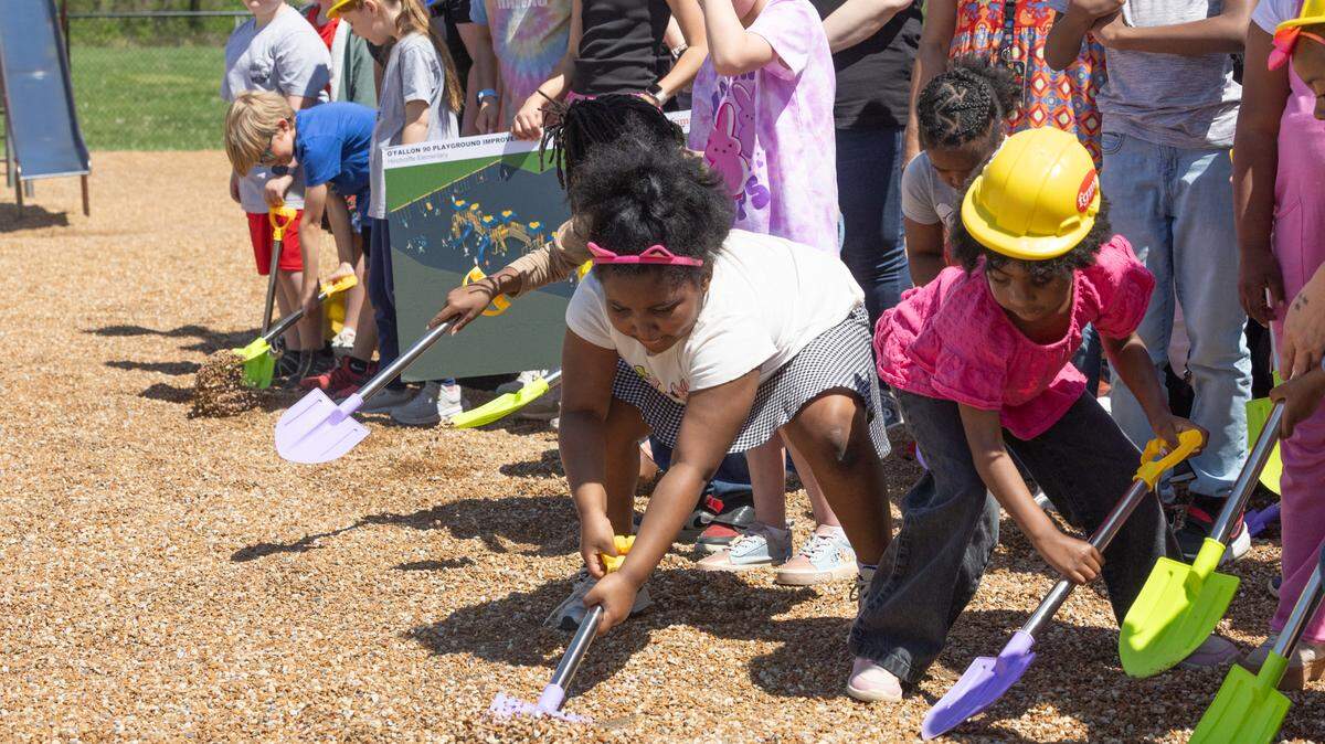 Children, teachers, developers and PTO members break ground for a new playground at Hinchcliffe Elementary in O’Fallon on April 22.